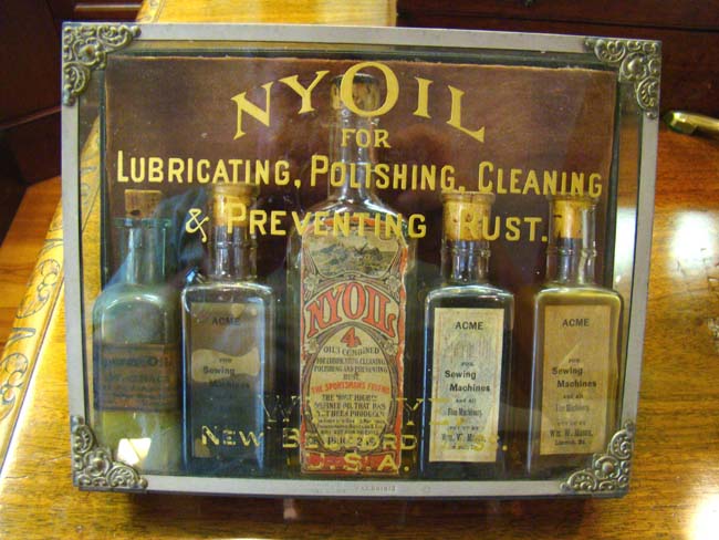 A RARE original Whale Oil display case for NYOIL containing 5 bottles circa 1890-1900